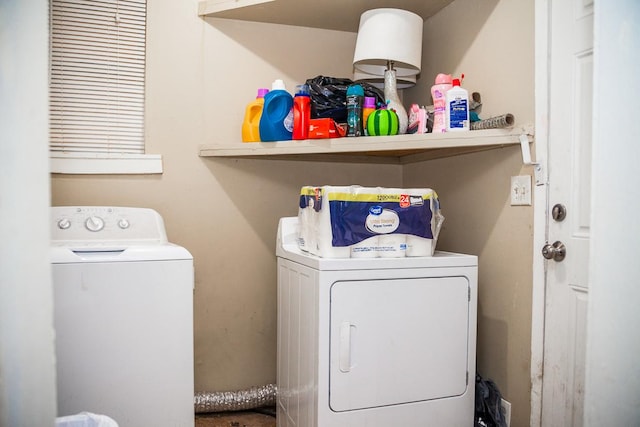 clothes washing area featuring laundry area and washer and dryer