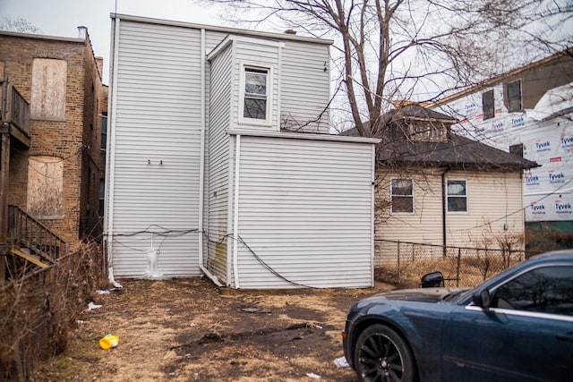 view of property exterior featuring fence