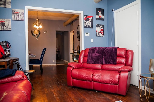 living room featuring wood-type flooring and baseboards