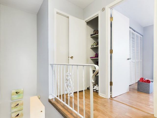 hall with wood finished floors