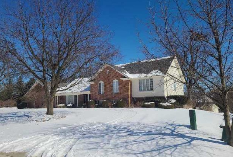 view of front of house featuring brick siding