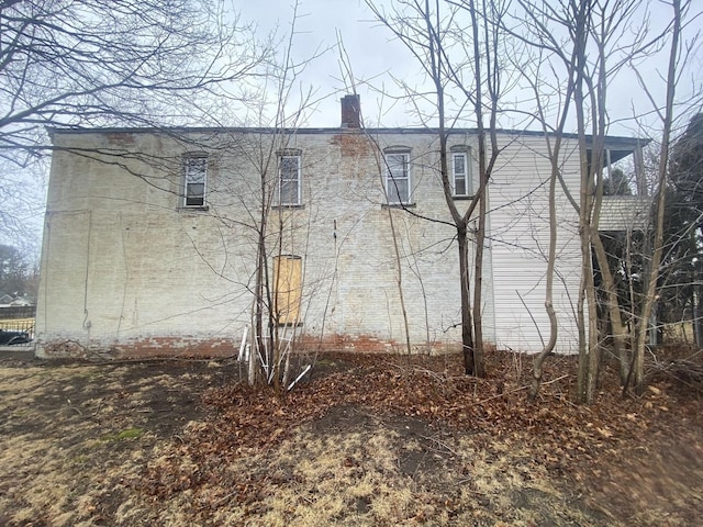 view of side of property with a chimney