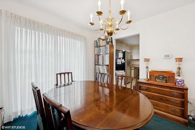 carpeted dining room with a notable chandelier