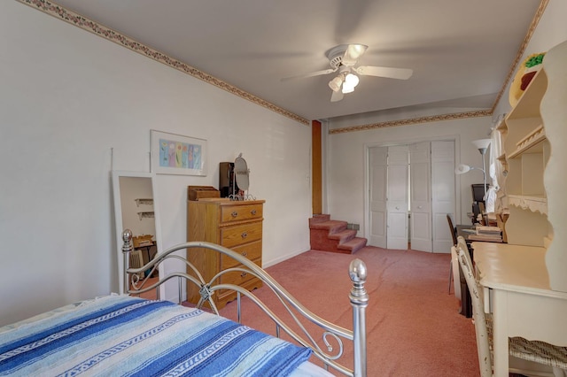 carpeted bedroom with a closet and a ceiling fan