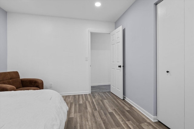 bedroom featuring recessed lighting, wood finished floors, and baseboards