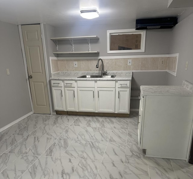 kitchen with a sink, white cabinets, marble finish floor, ventilation hood, and open shelves