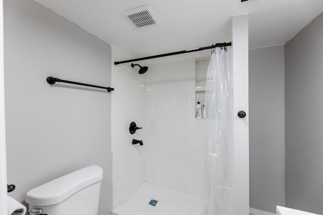 full bath with a stall shower, visible vents, and toilet