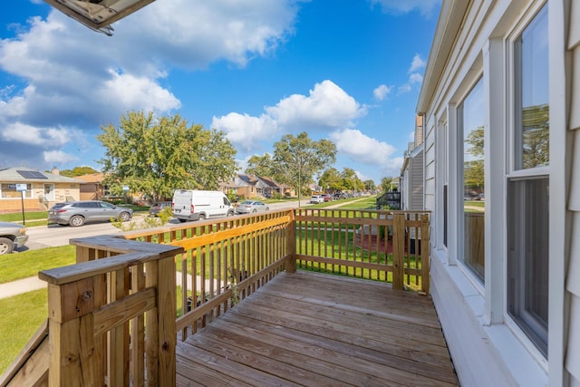 wooden terrace with a residential view