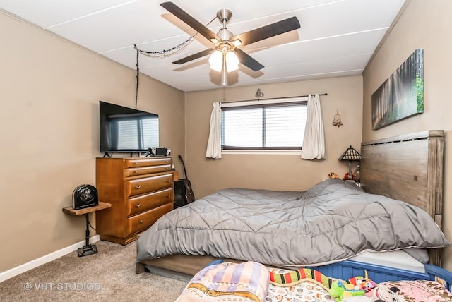 bedroom featuring carpet floors, a ceiling fan, and baseboards