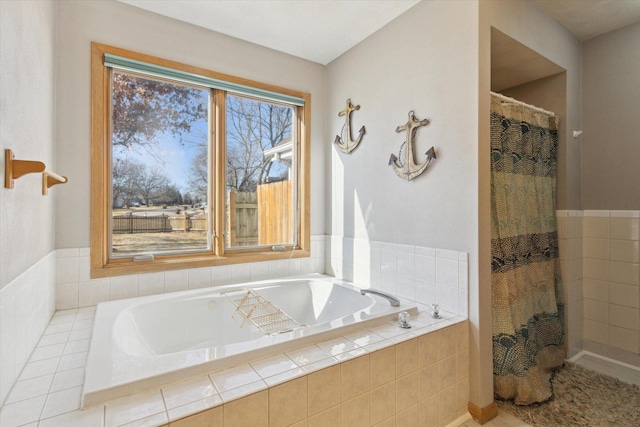 full bathroom featuring curtained shower and a bath