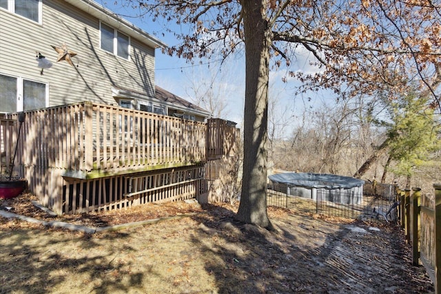 view of yard with fence and a wooden deck