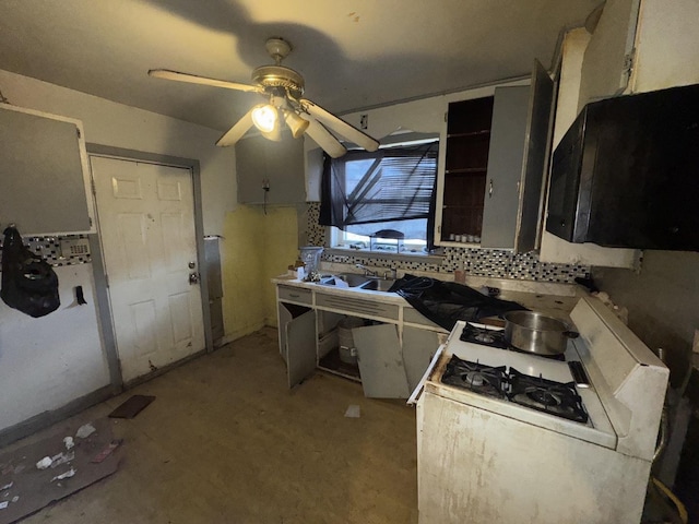 kitchen featuring a ceiling fan and decorative backsplash