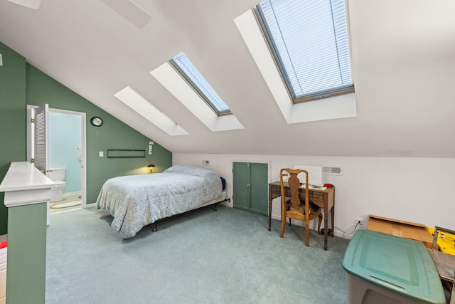 bedroom featuring vaulted ceiling, carpet floors, and visible vents