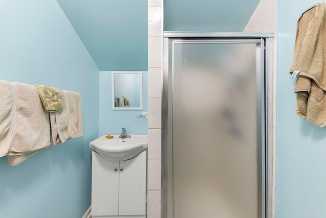 bathroom featuring a shower stall and vanity