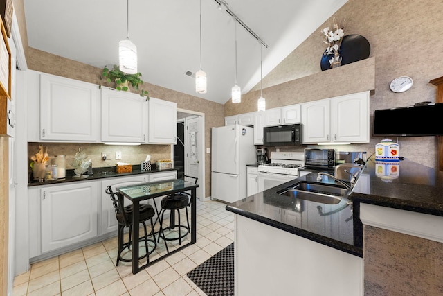 kitchen with white appliances, high vaulted ceiling, white cabinets, and a sink