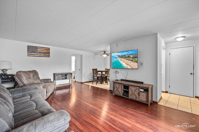 living room featuring baseboards and wood finished floors