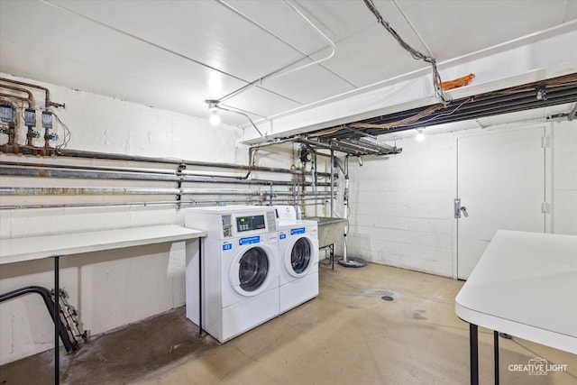 community laundry room featuring washing machine and dryer