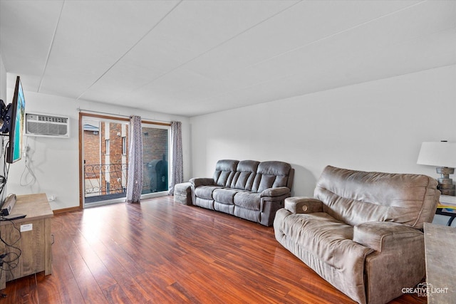 living area with wood finished floors and a wall mounted AC