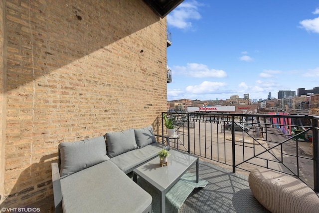 balcony featuring a view of city and an outdoor living space