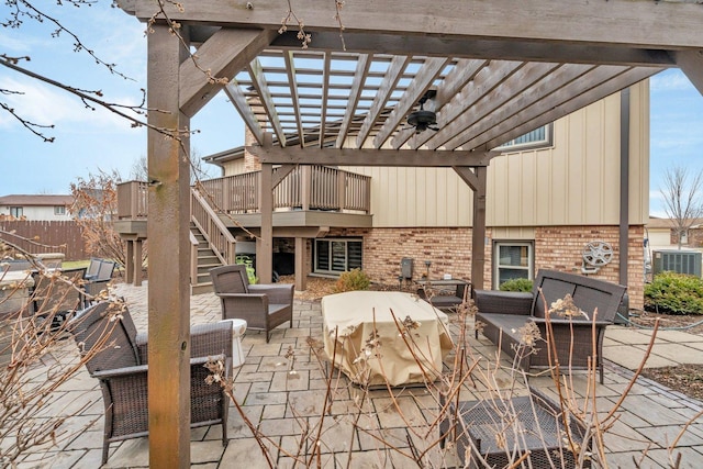 view of patio / terrace featuring a pergola, stairs, fence, an outdoor living space, and central AC