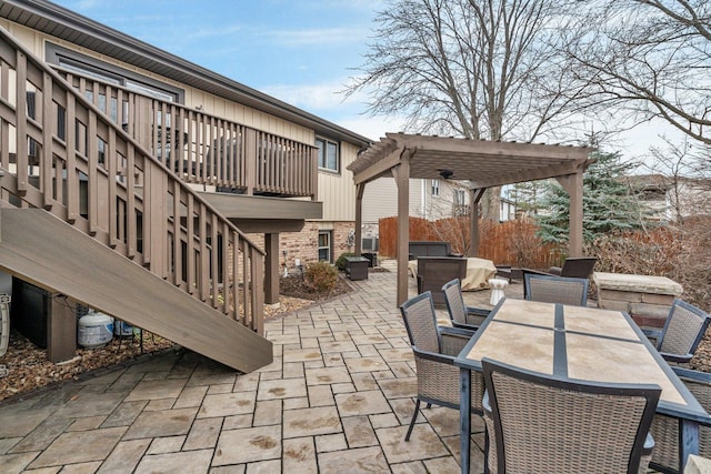 view of patio featuring outdoor dining space, a grill, and a pergola