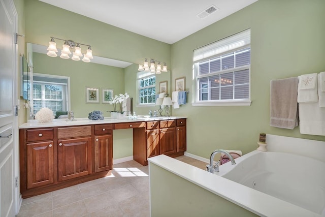 bathroom with double vanity, visible vents, a sink, a whirlpool tub, and tile patterned floors