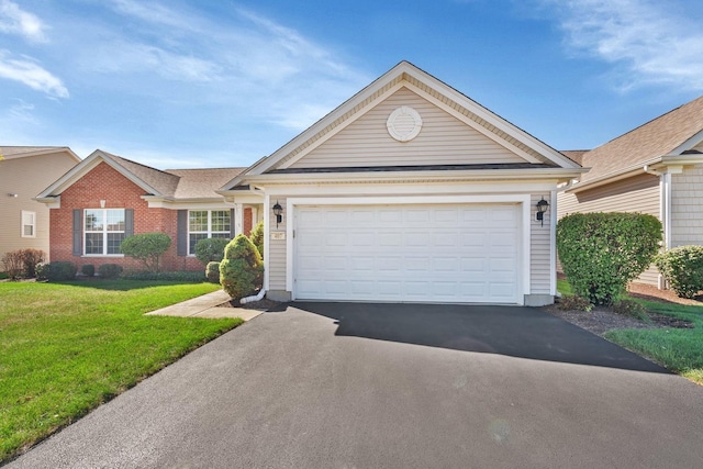 single story home with driveway, an attached garage, a front lawn, and brick siding