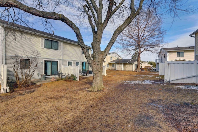 view of yard featuring fence and a patio