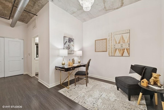 office area with baseboards and wood finished floors