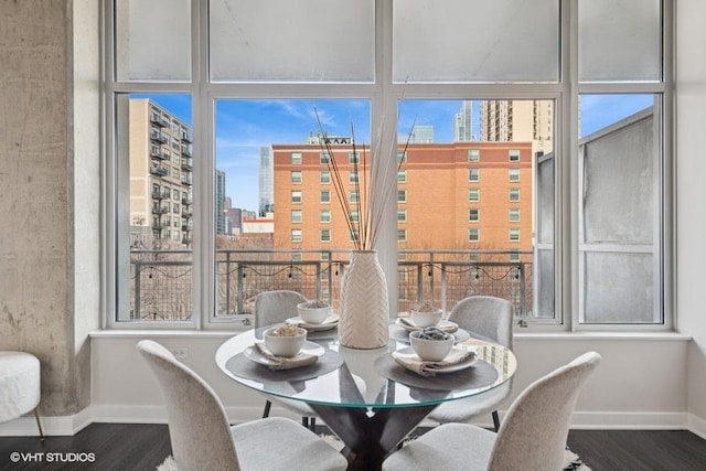 sunroom / solarium with a healthy amount of sunlight and a view of city