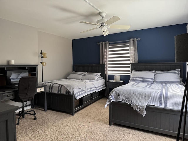 carpeted bedroom with a ceiling fan