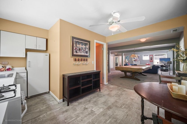 interior space with pool table, visible vents, baseboards, a ceiling fan, and light wood-type flooring