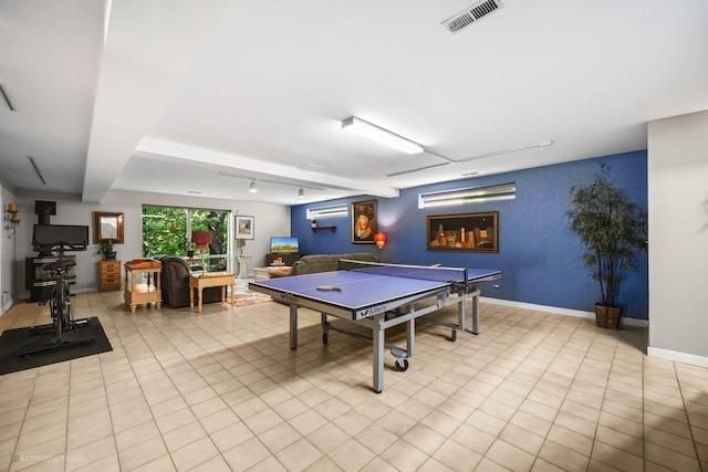 game room with light tile patterned floors, baseboards, and visible vents