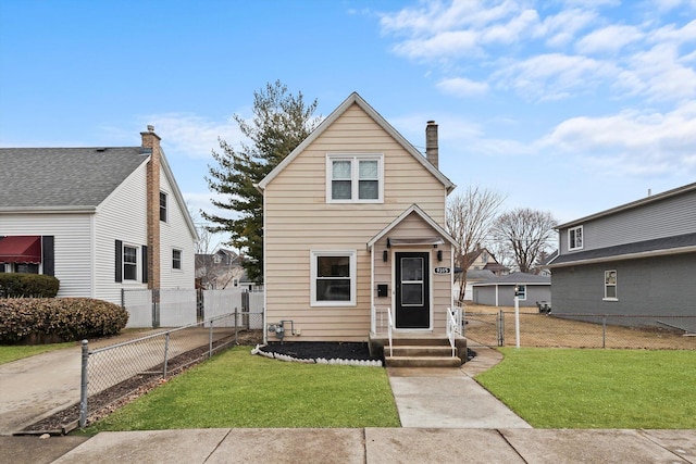 view of front of property featuring a chimney, a front yard, and fence