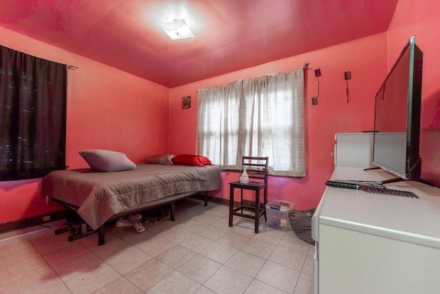 bedroom with light tile patterned floors