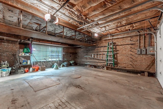 garage with electric panel and a garage door opener