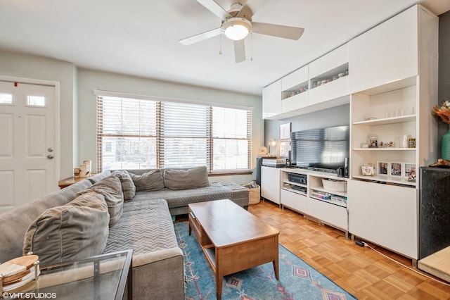 living area featuring ceiling fan