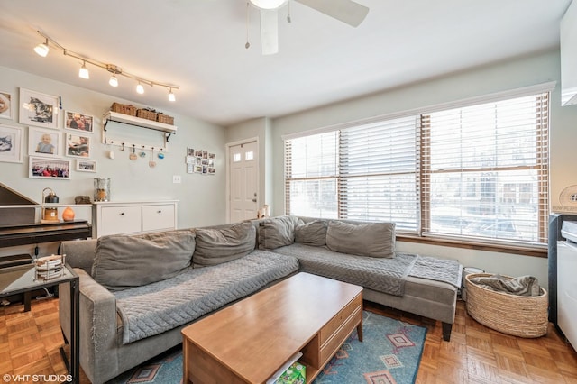 living area featuring a ceiling fan