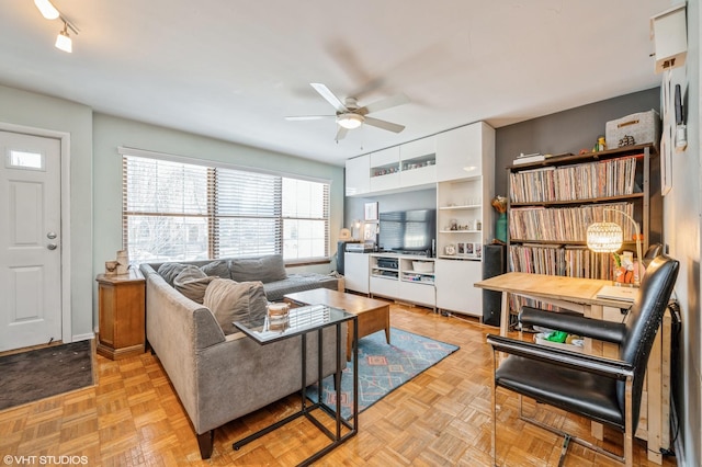 living area featuring ceiling fan