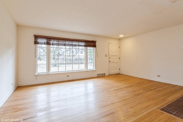 spare room featuring recessed lighting, baseboards, visible vents, and light wood finished floors