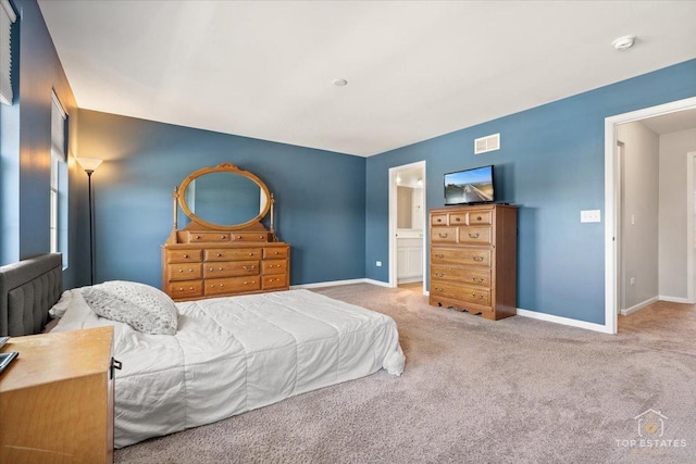 carpeted bedroom with baseboards and visible vents