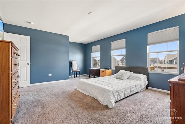 bedroom with carpet flooring and baseboards