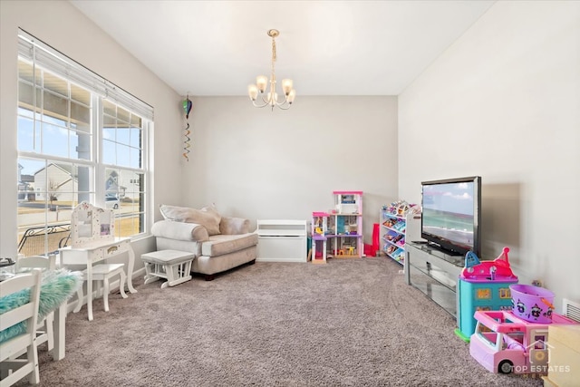 recreation room featuring an inviting chandelier and carpet floors