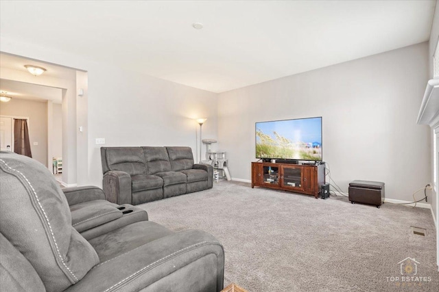 living room featuring baseboards and carpet flooring