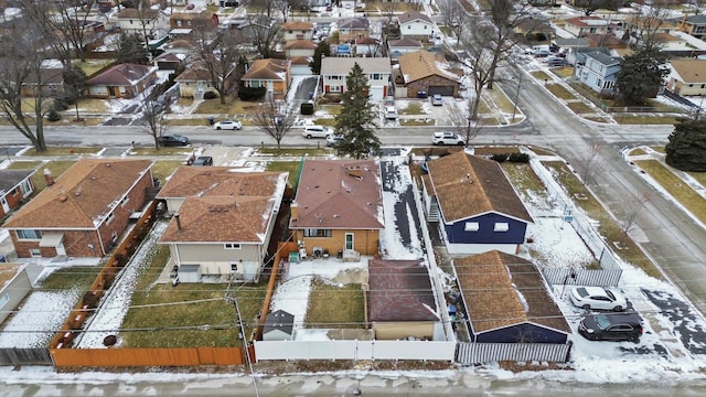 snowy aerial view with a residential view