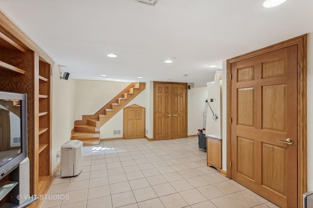 interior space featuring recessed lighting, visible vents, stairway, and light tile patterned flooring