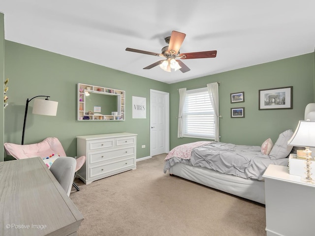 bedroom with ceiling fan and carpet flooring