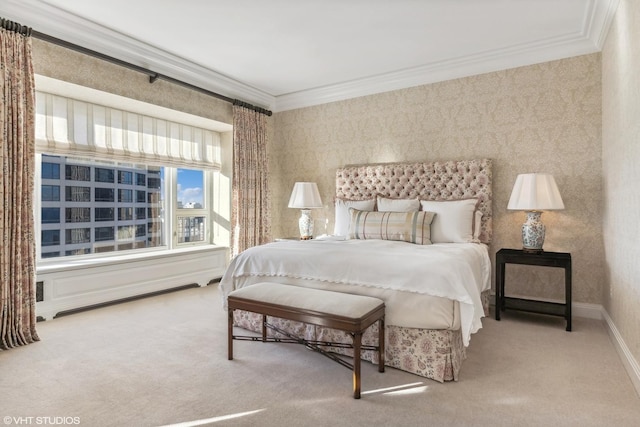 bedroom with ornamental molding and wallpapered walls