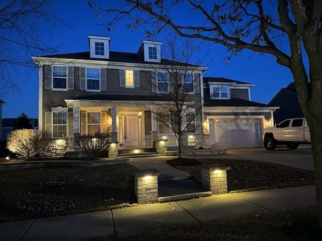 view of front of house featuring driveway and an attached garage