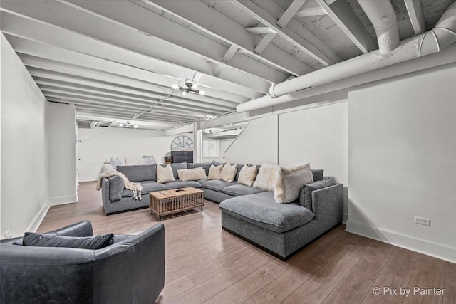 living room featuring wood finished floors and baseboards